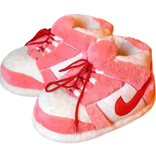 Pink and white plush sneaker-style slippers with soft faux fur and red laces on a white background.